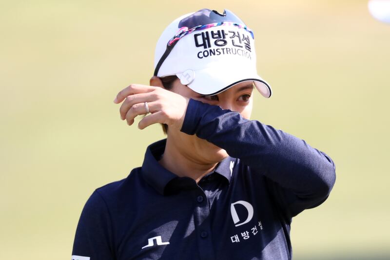 Na-yeon Choi of South Korea sheds tears after holing out on the final hole of BMW Ladies Championship in Seoul. She marked her final outing on the tour with a hole in one during her third round. Photograph:  Chung Sung-Jun/Getty Images