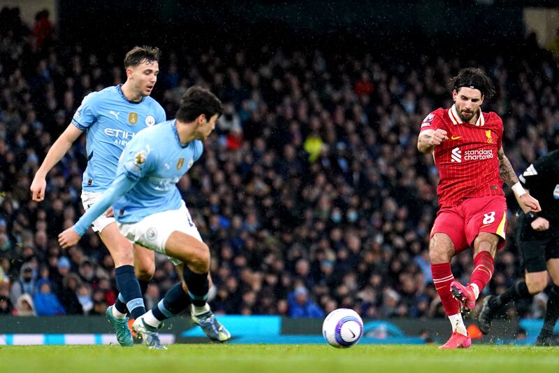 Liverpool's Dominik Szoboszlai scores against Manchester City. Photograph: Martin Rickett/PA