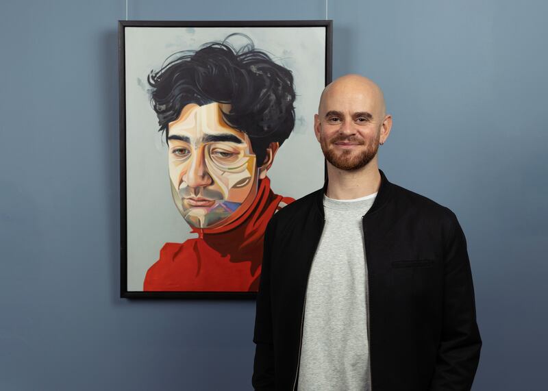 National Gallery of Ireland’s Zurich Portrait Prize 2022 winner David Booth with his portrait Salvatore, 2021. Photograph: Abe Neihum 