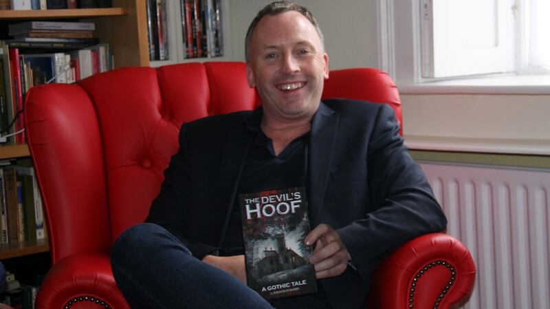 Jonathan Barry with his novel, The Devil’s Hoof