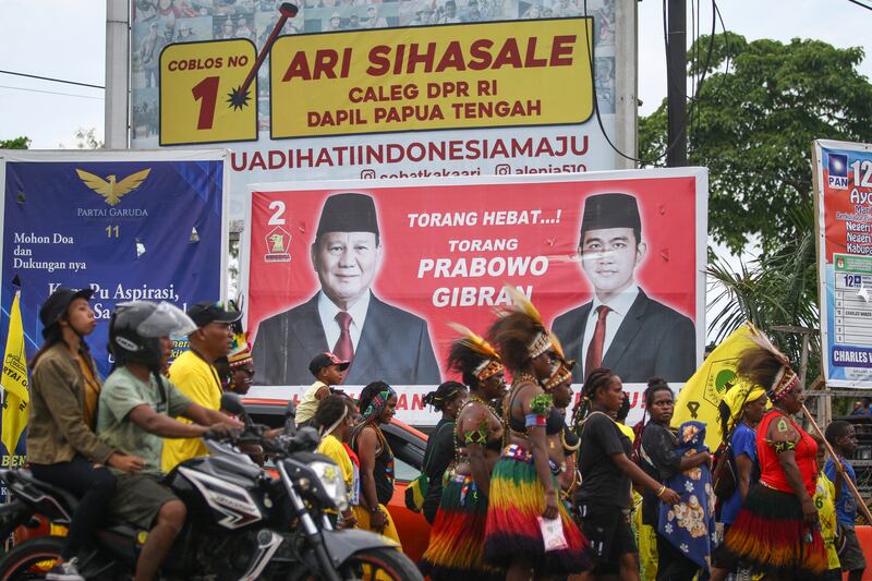 A billboard showing posters of presidential candidate Prabowo Subianto  and vice presidential candidate Gibran Rakabuming Raka in Timika, Central Papua. Photograph: Sevianto Pakiding/AFP via Getty Images