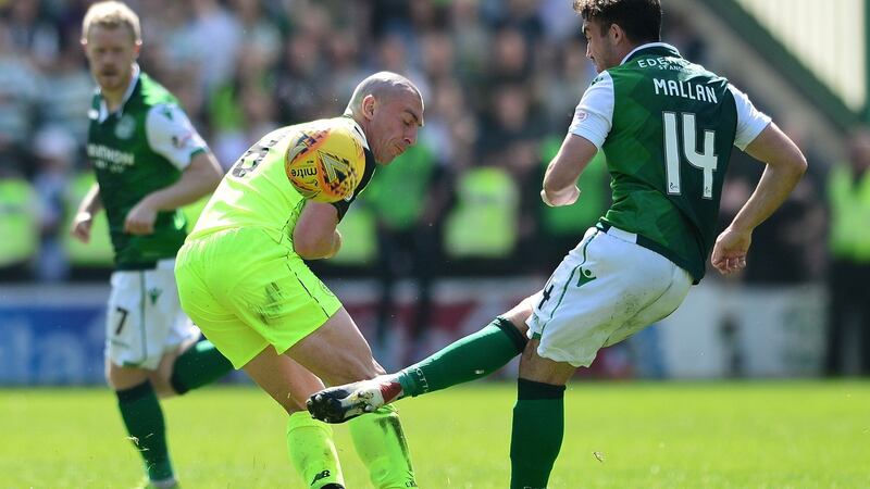 Scott Brown tackles Stevie Mallan during Celtic’s stalemate with Hibs in Edinburgh. Photograph: Mark Runnacles/Getty