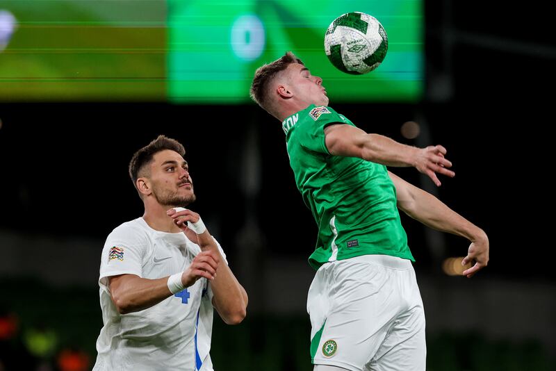 Greece's Konstantinos Mavropanos and Ireland's Evan Ferguson. Photograph: Morgan Treacy/Inpho