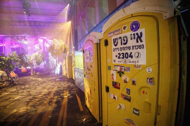 Toilet cabins of the Nova Festival on display at the Nova Music Festival exhibition at the former Tempelhof Airport in Berlin, Germany. Photograph: EPA