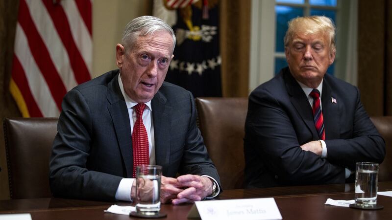 Jim Mattis, US secretary of defence, speaks next to Donald Trump during a briefing with senior military leaders in the Cabinet Room of the White House in Washington on Tuesday. Photograph: Al Drago/Bloomberg