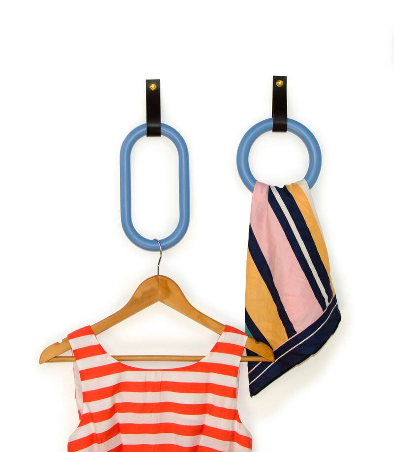 Loop hooks, with leather straps and in circular or rectangular shapes, available in five different finishes,  are designed by Warren Hayes.