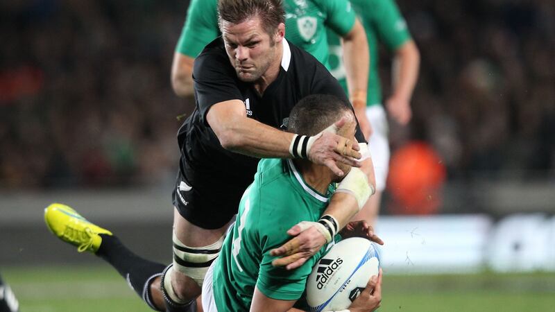Simon Zebo is tackled by New Zealand’s Richie MCcaw on his Ireland debut in Auckland back in 2012. Photograph: Billy Stickland/Inpho