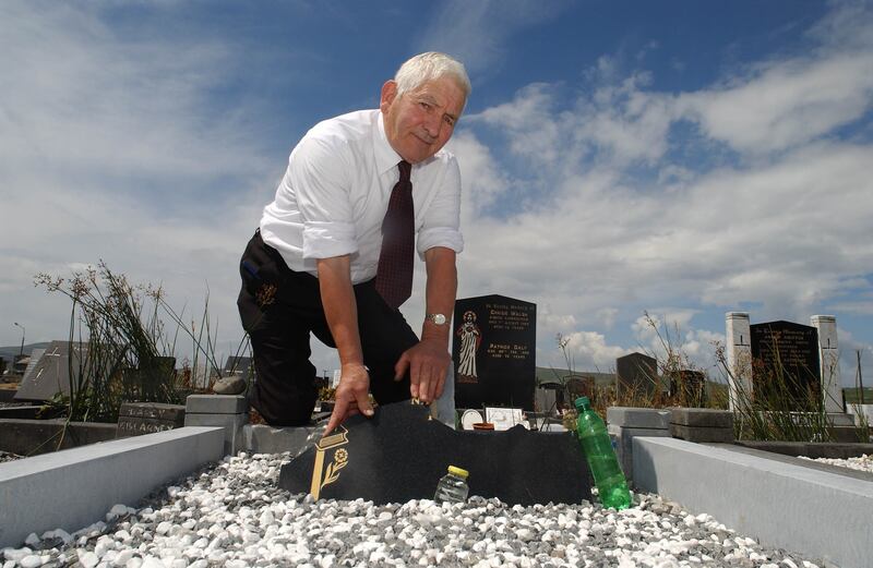 Caherciveen undertaker Tom Curnane, who did up the grave of Baby John, at the grave in 2004. Photograph: Domnick Walsh