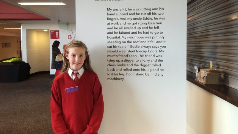 Ciara Mullally from Kilkenny poses with a print of her contribution to the Grandad Built My House book. Photograph: Sorcha Pollak/The Irish Times