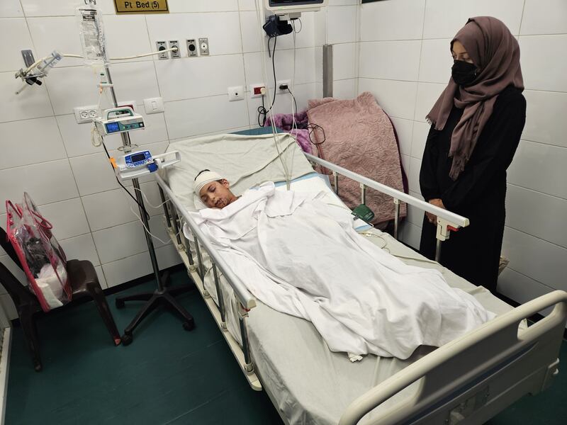 A wounded Palestinian child, the only surviving child of doctor Dr Alaa al-Najjar, lies in a hospital bed at Nasser Hospital in Khan Yunis after an Israeli airstrike hit their home. Photograph: Hani Alshaer/Anadolu