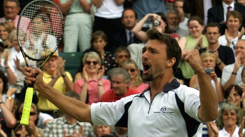 Goran Ivanisevic celebrates after defeating Britain’s Tim Henman in the semi finals. Photograph: Gerry Penny/AFP via Getty Images