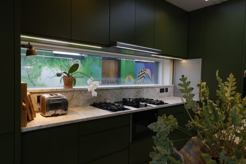 Kitchen window with mural outside. Photograph: Nick Bradshaw 
