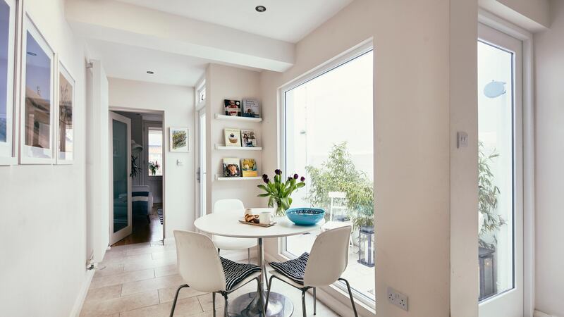 The dining area beside the courtyard and  the kitchen. It is where the shower room and a corridor used to be. Photograph: Philip Lauterbach