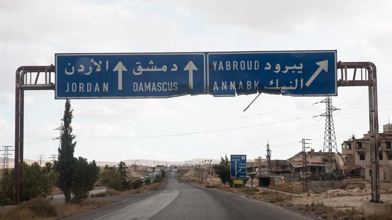 A Syrian sign shows the road to Damascus. Photograph: Sally Hayden