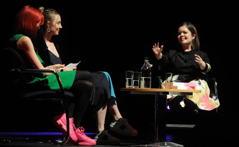 Feminists Don’t Wear Pink: Sinéad Burke, Saoirse Ronan and Scarlett Curtis (left) at the O’Reilly Theatre in Dublin on Thursday night. Photograph: Aidan Crawley