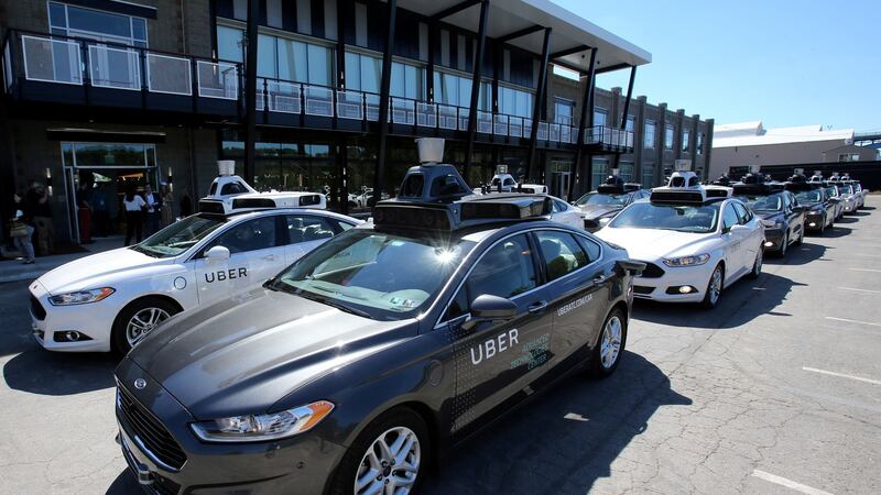 A fleet of Uber’s Ford Fusion self-driving cars. Photograph: Aaron Josefczyk/Reuters