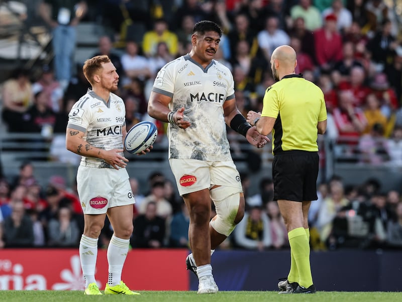 La Rochelle's Ihaia West and Will Skelton run foul of referee Andrea Piardi. Photograph: Billy Stickland/Inpho