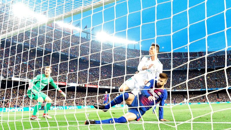 Cristiano Ronaldo scores Real Madrid’s opener against Barcelona. Photograph: Lluis Gene/AFP