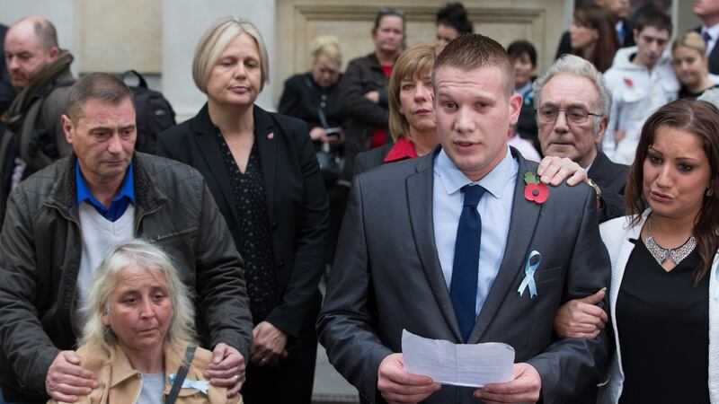 Stepmother of Becky Watts and mother of Nathan Matthews, Anjie Galsworthy, sits in her wheelchair accompanied by Becky Watts’ father, Darren Galsworthy, (L) as Sam Galsworthy reads a statement to the media outside Bristol Crown Court. Photograph: Matt Cardy/Getty Images.