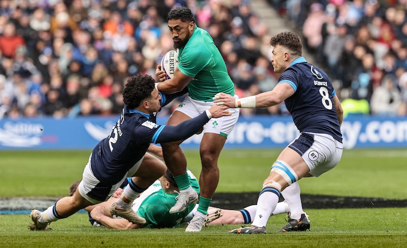 Ireland’s Bundee Aki tackled by Sione Tuipulotu and Jack Dempsey of Scotland at Murrayfield. Photograph: Billy Stickland/Inpho