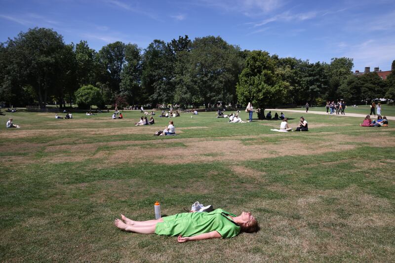 People enjoying the sunny weather in Merrion Square Dublin as the heat rises across the country. Photograph: Bryan O’Brien