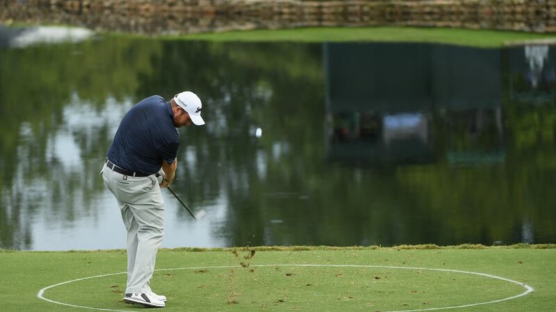 Lowry plays from the drop zone at the 17th. Photo: Ross Kinnaird/Getty Images