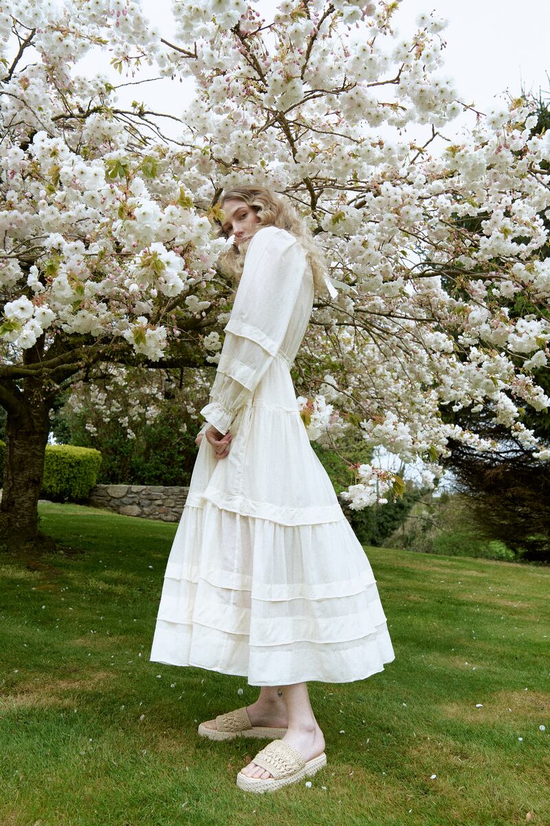 White dress, Ulla Johnson at Havana €1,000; raffia sandals, €36.99, H&M; green crystal necklace, Jenny Vander Vintage, €425