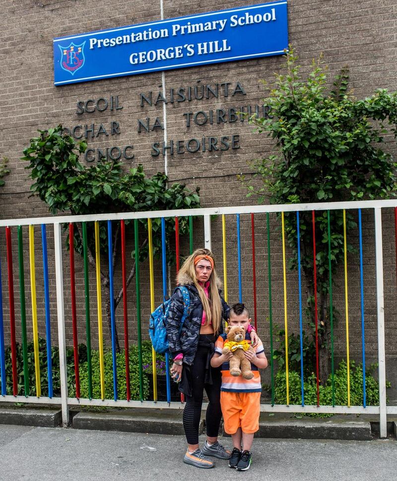 Nadine Staunton and her son Maddix outside Presentation Primary School George’s Hill, where he has attended for several years but will no longer have a place in September. Photograph: James Forde