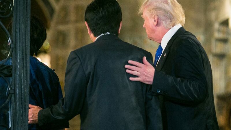 President Donald Trump and Japanese prime minister Shinzo Abe head to dinner, at the Mar-a-Lago resort in Palm Beach, Florida.  Photograph: Al Drago/The New York Times