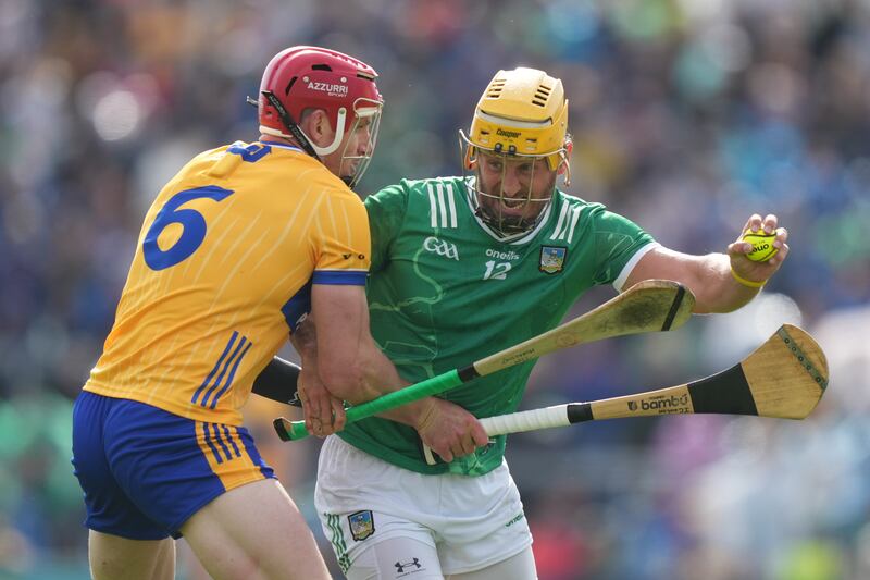 Clare's John Conlon tackles Limerick's Tom Morrissey. Photograph: James Lawlor/Inpho