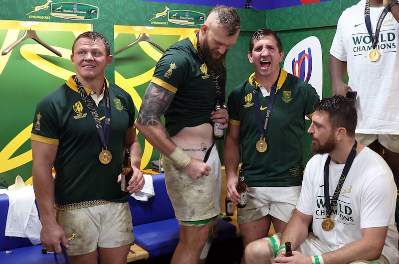 South Africa's RG Snyman shows his tatoo alongside fellow members of the Springbok's 'Bomb Squad' as they celebrate their victory over New Zealand in the 2023 Rugby World Cup Final. Photograph: Julian FinneyWorld Rugby via Getty Images