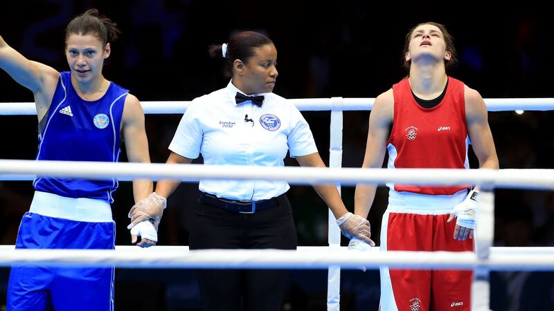 Katie Taylor shows the tension of the moment as she awaits the outcome of her final bout against Russia’s Sofya Ochigava. Photograph: Dan Sheridan/Inpho