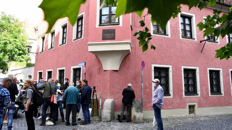 A group of people at the blocked street leading to the residence of Georg Ratzinger. Photograph: Lukas Barth-Tuttas/EPA