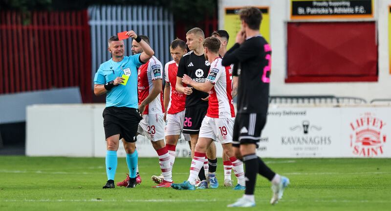 Referee Ladislav Szikszay shows Kalju's Rommi Siht a red card. Photograph: Ryan Byrne/Inpho