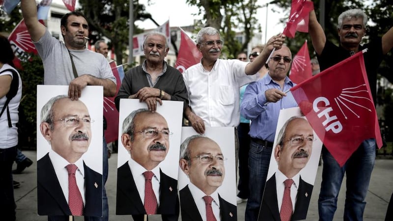 Supporters of Turkey’s main opposition Republican People’s Party (CHP) wave flags and hold posters of leader Kemal Kilicdaroglu during a rally in the district of Kadikoy in Istanbul. Photograph: Yasin Akguly/AFP/Getty Images.