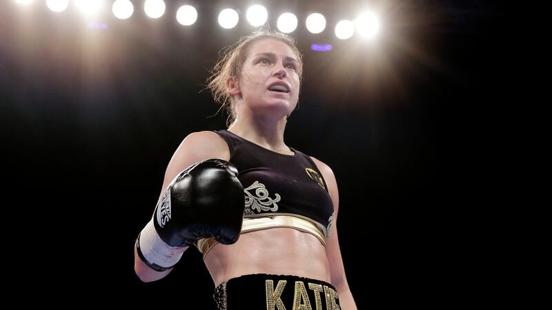 Katie Taylor celebrates after winning her fight with Karina Kopinska. Photo: Henry Browne/Reuters
