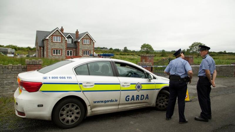 Gardaí at the house in Banada, Co Sligo where a nine-year-old Brandon  Skeffingtonwas found with stab wounds in the house yesterday. The body of his brother Shane   was later found in a shed nearby. Photograph : Keith Heneghan