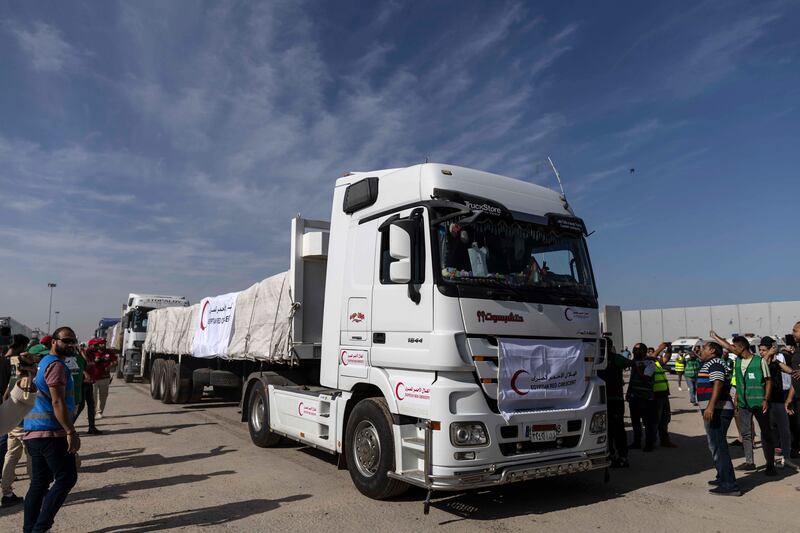 Aid convoy trucks cross the Rafah border into Gaza from the Egyptian side on Saturday.  The aid convoy was organised by a group of Egyptian NGOs. Photograph: Mahmoud Khaled/Getty Images