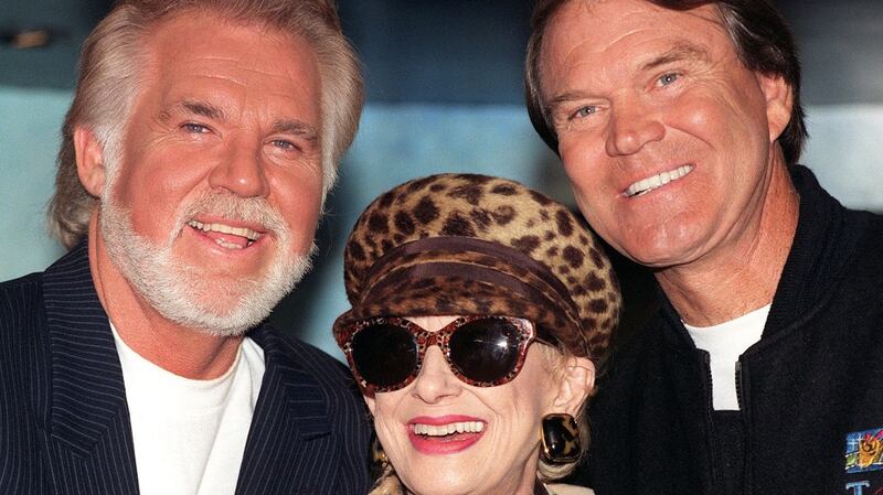 Veteran Country and Western singers (L-R) Kenny Rogers, Tammy Wynette and Glen Campbell in central London in 1996  for a news cinference to launch their Unforgettable tour around Britain. Photograph: Rebecca Naden/PA.