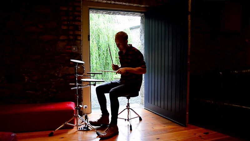 Ben Roe from Wicklow uses a practice kit  at 21 Drums camp in Grouse Lodge, Co Westmeath.  Photograph: Bryan O’ Brien