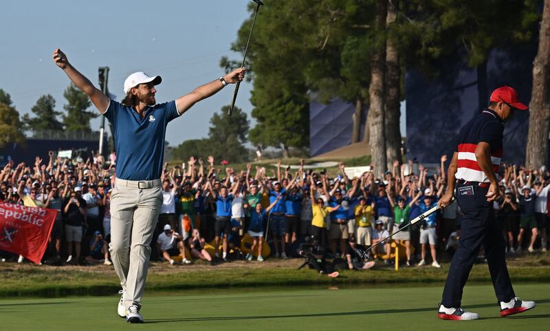 Tommy Fleetwood (L) celebrates the winning putt on the 17th green during his singles match against Rickie Fowler (R) on the final day of the Ryder Cup in Rome. Photograph: Paul ELLIS / AFP