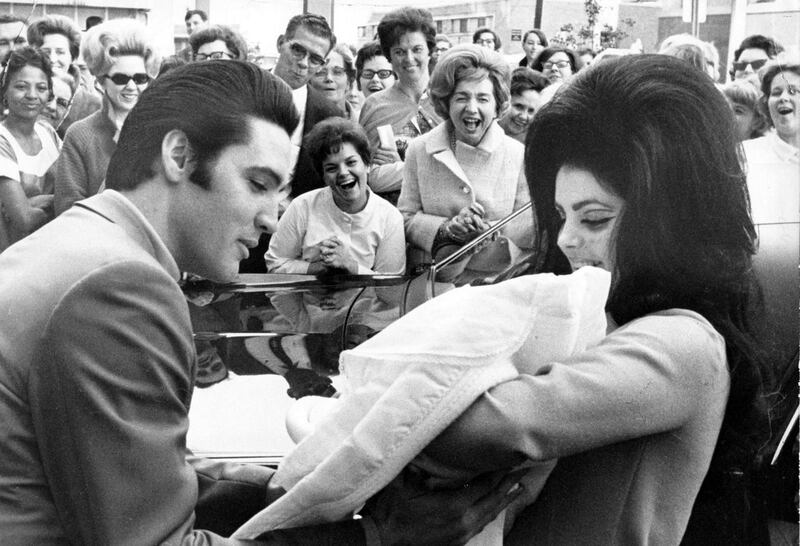 Elvis Presley and Priscilla with their baby daughter Lisa Marie in February 1968. Photograph: PA