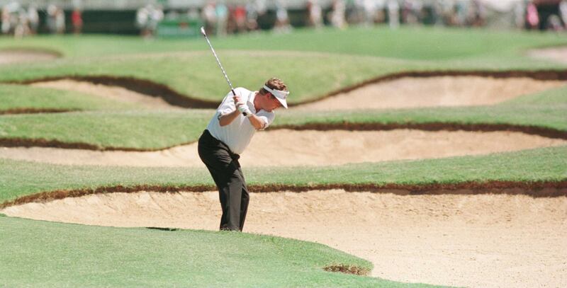 Richard Boxall of England playing his second shot to the 18th hole from the fairway bunkers during his second round in the Heineken Classic in Perth. Photograph: Stephen Munday/Allsport