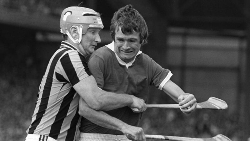 Jimmy Barry Murphy of Cork tackled by Brian Cody of Kilkenny. Photograph: Billy Strickland/Inpho