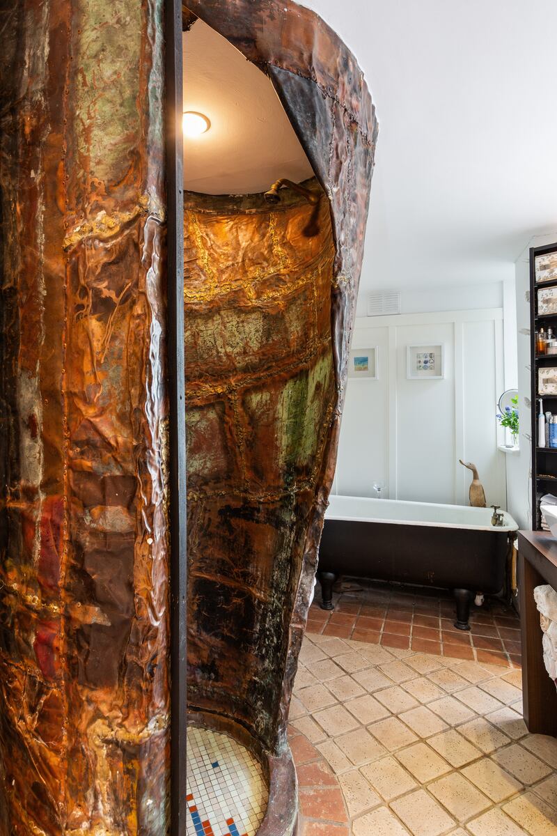 Garden-level unit: bathroom with copper cocoon shower