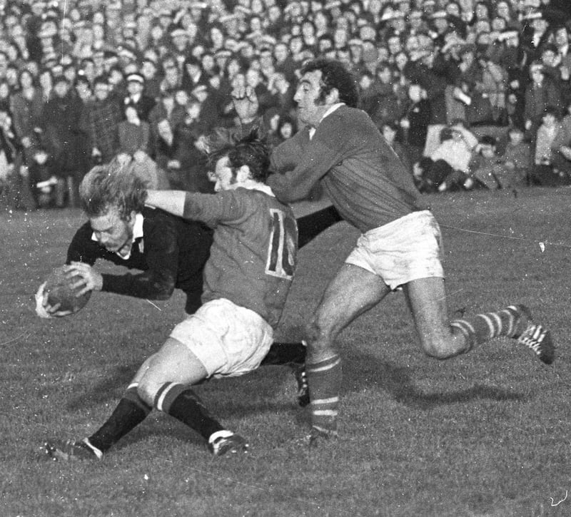 Barry McGann and Jim Buckley tackling New Zealand outhalf Ian Stevens. Photograph: Dermot O'Shea