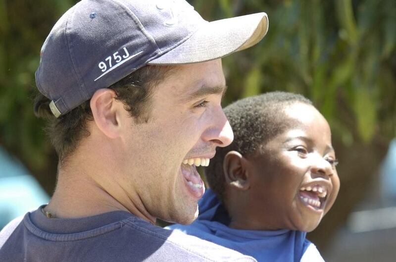 Alan Kerins with Mwiya during one of his projects in Africa.
