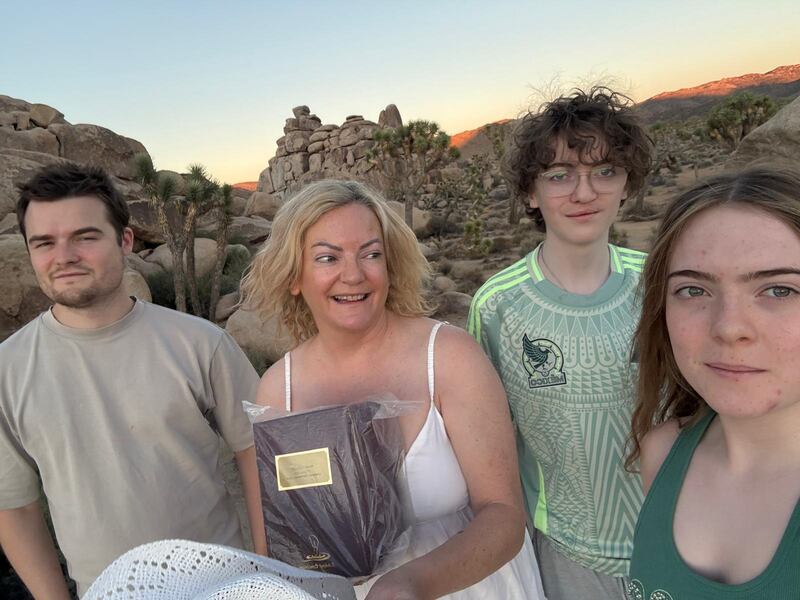 Chantelle Guilfoyle, whose husband Noel died in 2023, with their children Mark (27), Indi (16) and Hunter (13) in the Mojave Desert in California last month where they spread his ashes