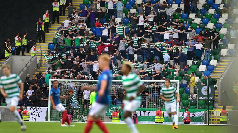 Celtic fans do the Poznan during the game. Photo: Arthur Allison/Pacemaker Press