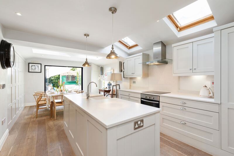 Seamless lines between the new kitchen extension and the back garden  allowed the current residents to celebrate Christmas dinner outside during lockdown.